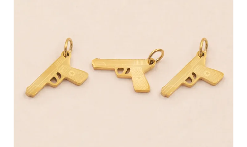 Colgante Pistola Acero Inox. 14*7mm Oro