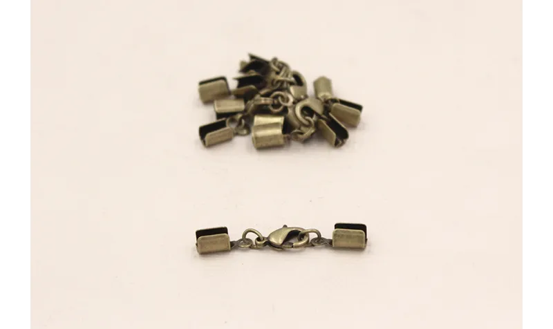 TERMINAL MOSQUETON ORO VIEJO / Terminales de Latón / Zamak