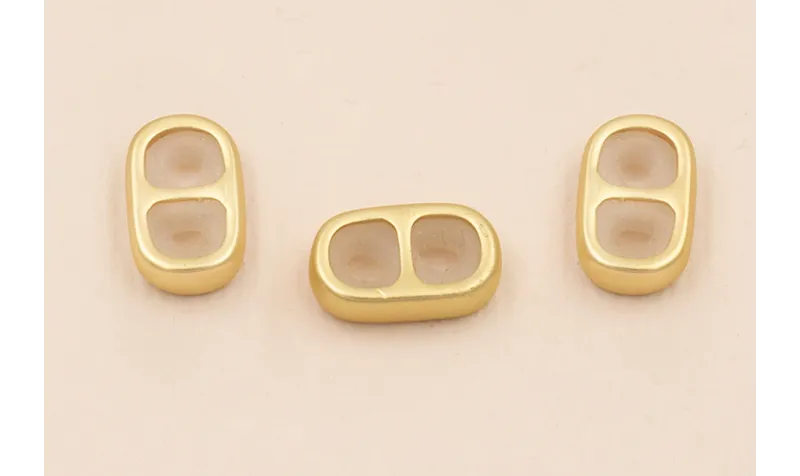 Terminal 2 agujeros con silicona 13*7mm Oro Mate / Terminales de Latón / Zamak