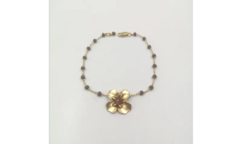 Pulsera facetadas gris y flor oro