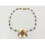 Pulsera facetadas gris y flor oro