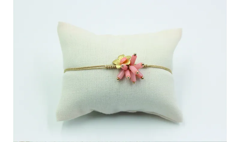 Pulsera nudo serpiente en color oro palido con cor