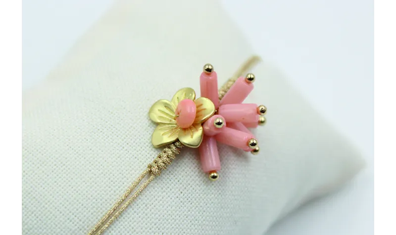 Pulsera nudo serpiente en color oro palido con cor