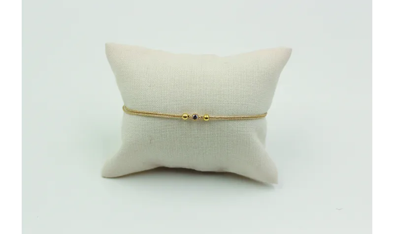 Pulsera de macrame en color oro palido y brillo de