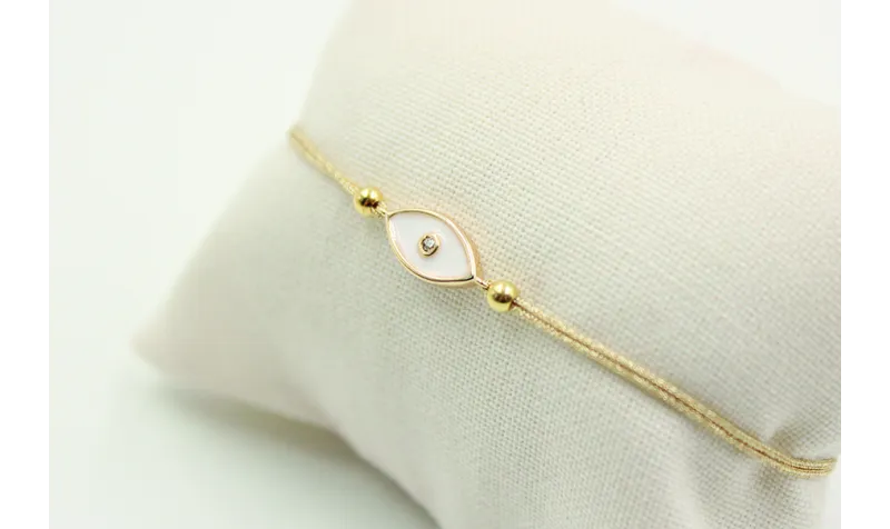 Pulsera de macrame en color oro palido y ojo turco