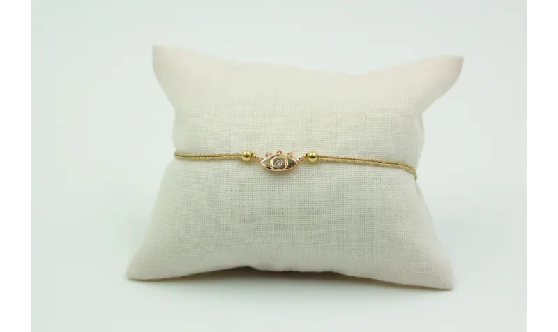 Pulsera de macrame en color oro palido y ojo turco