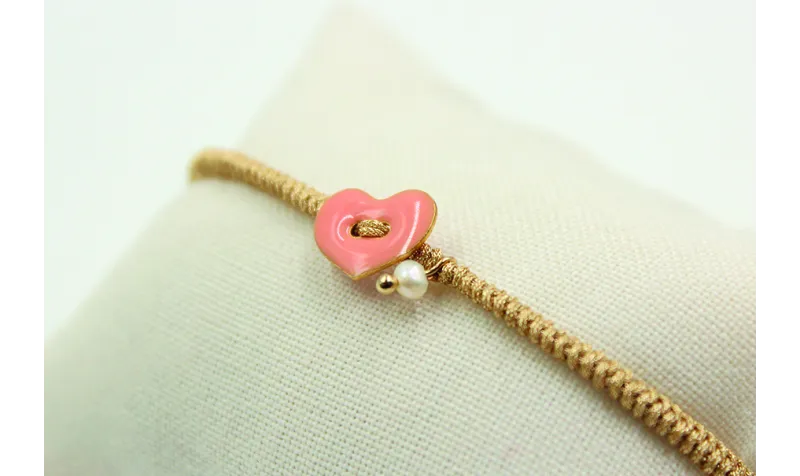 Pulsera entera nudo serpiente oro palido con coraz