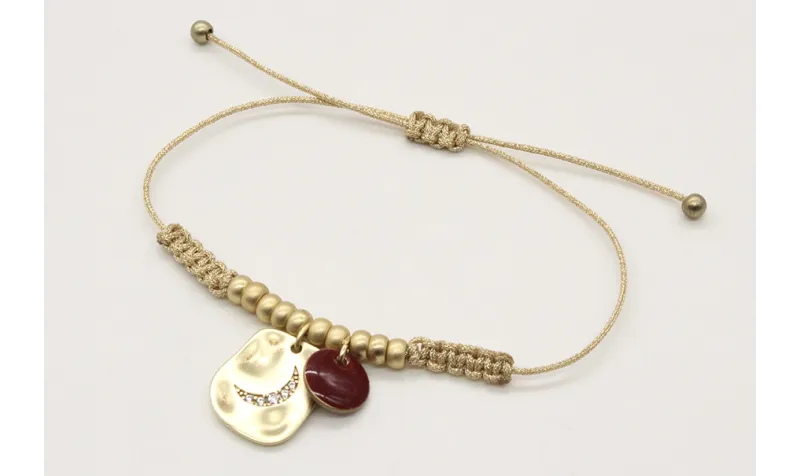 Pulsera macrame oro palido con bolas oro mate y co