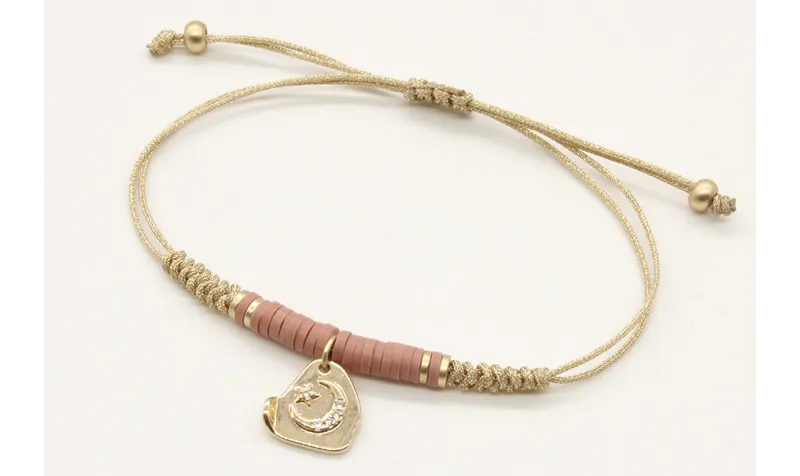 Pulsera nudo serpiente oro palido con lentejuelas 