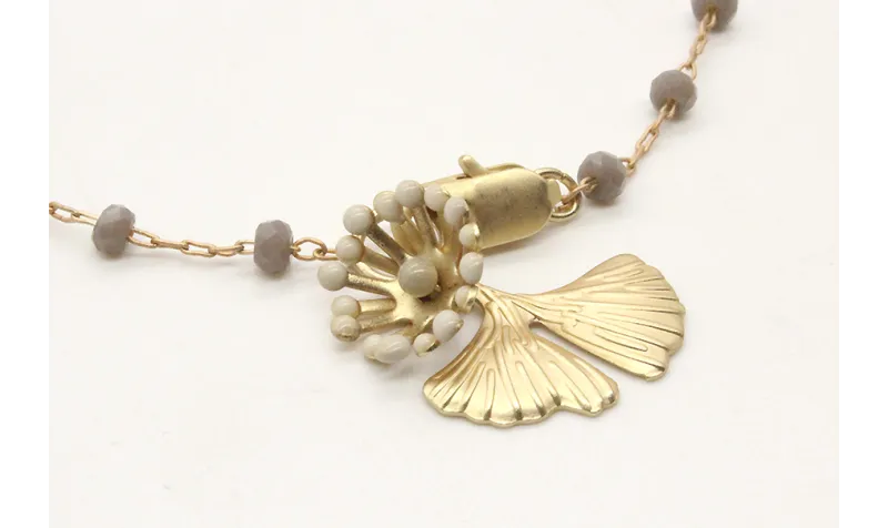 Pulsera cadena de facetadas grises rematada con gi