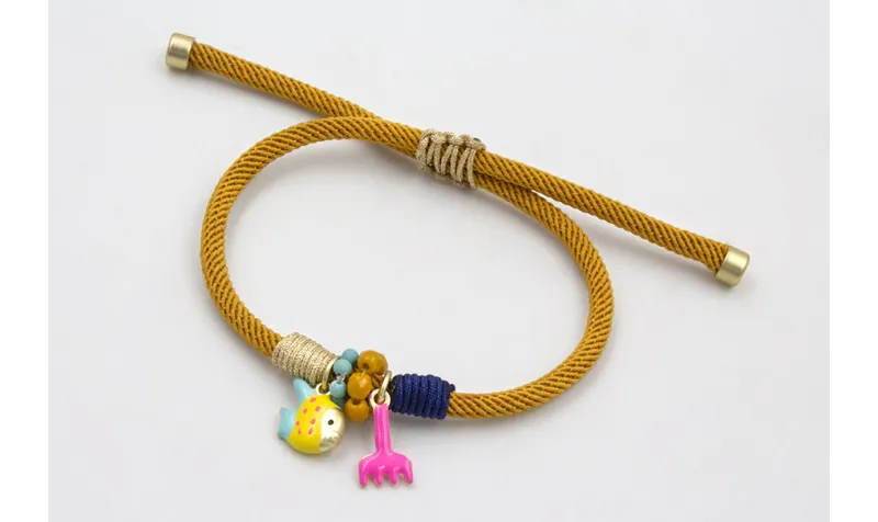 Pulsera cordón retorcido mostaza forrada con hilo 