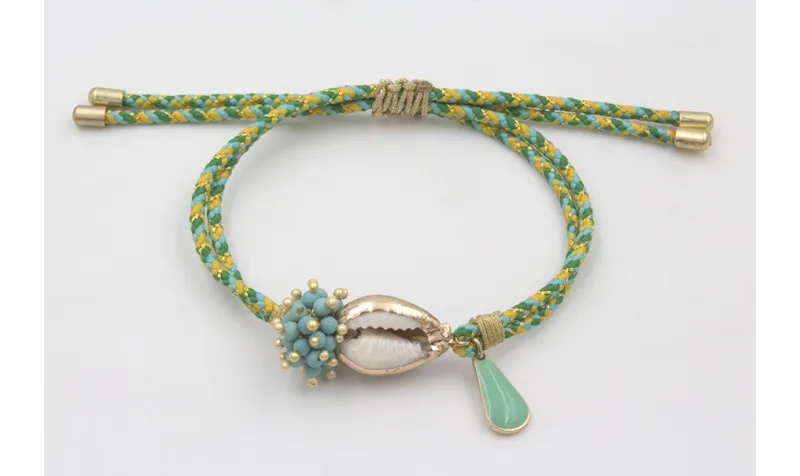 Pulsera de driza verde y turquesa con burruño bola