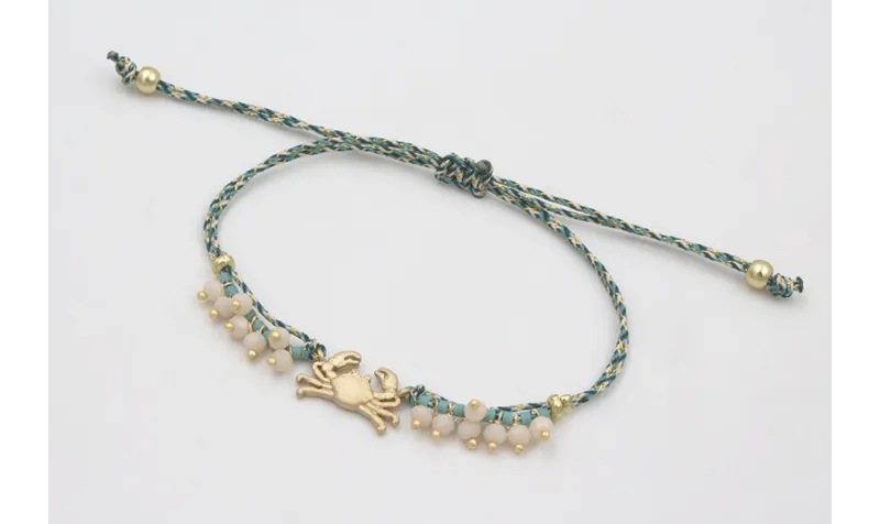 Pulsera micro driza azul, gris y oro con cangrejo 