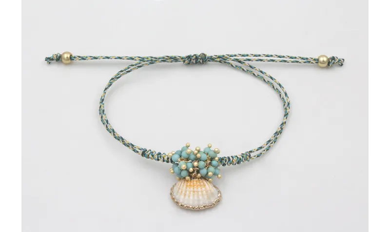Pulsera micro driza azul, gris y oro con concha bo