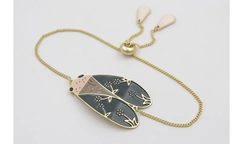 Pulsera cadena eslabón plano dorado mate con polil