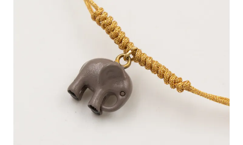 Pulsera hilo metálico dorado con nudo serpiente y 