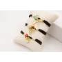 Pulsera seda natural rellena negra con tubo arquea