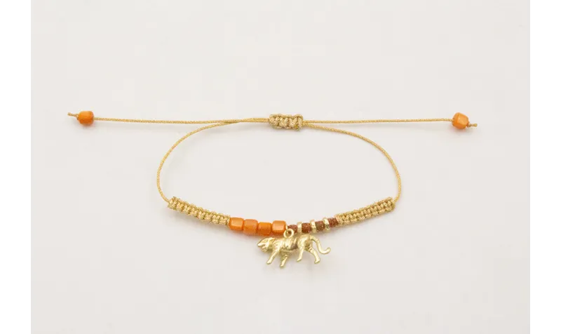 Pulsera hilo metalido dorado palido con nudo macra