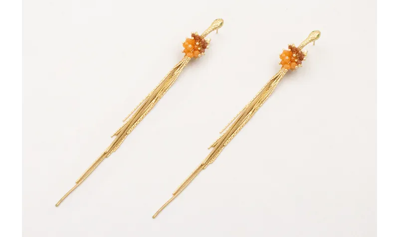 Pendientes serpiente ojos verdes con flecos dorado