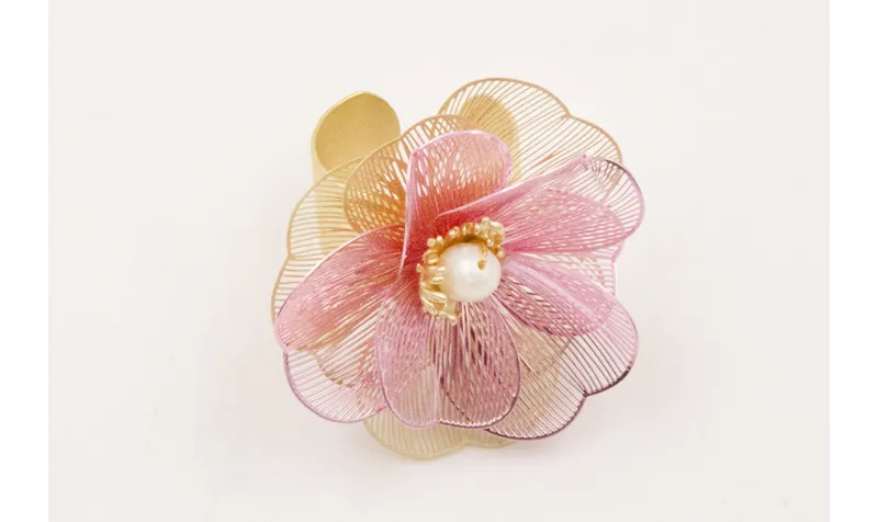 Anillo flores metalizadas ros y dorada rematado co