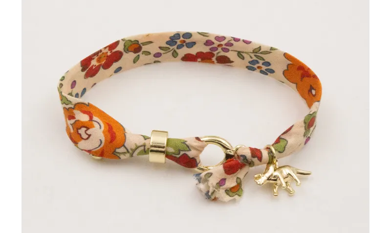 Pulsera lazo estampado bies flores lilas y moradas