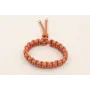 Pulsera cordón rosa palo con hilo dorado con nudo 