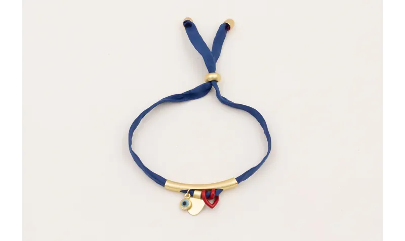 Pulsera seda natural azul marino con tubo curvado 