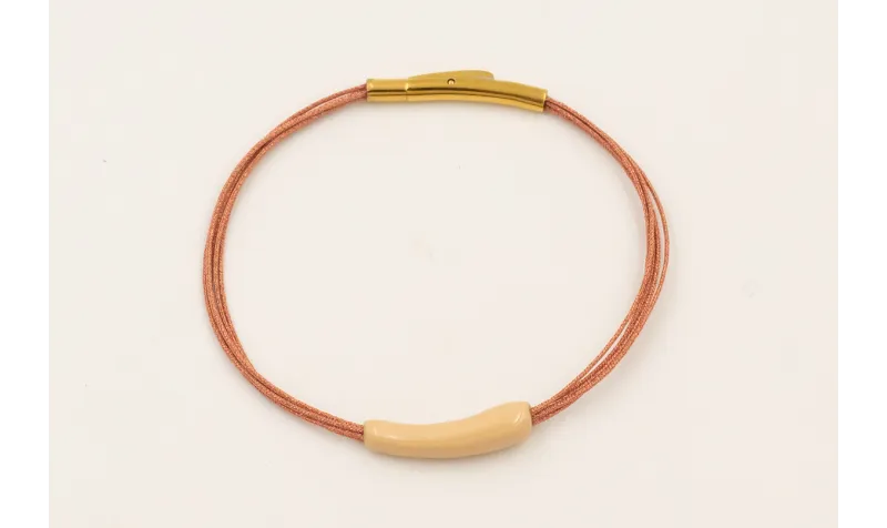 Pulsera hilo metalico oro rosa con tubo curvado ac