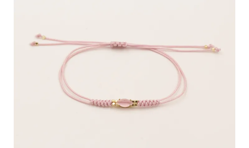 Pulsera hilo macramé lila con cabujón cristal rosa