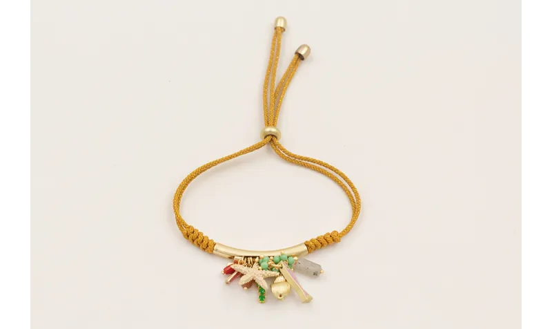 Pulsera cordón con hilo dorado color mostaza con n