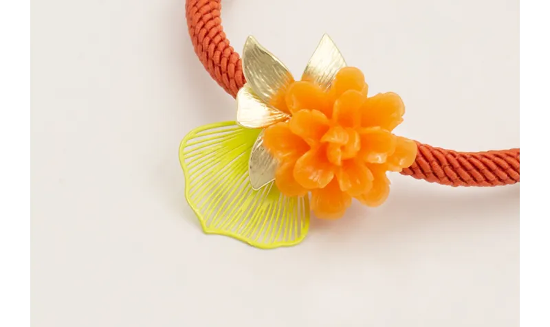 Pulsera cordón color oxido con centro flor resina 