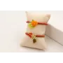 Pulsera cordón color oxido con centro flor resina 