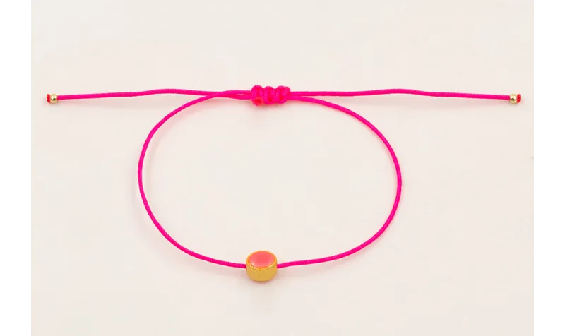 Pulsera hilo rosa fluor con entrepieza ovalada esm