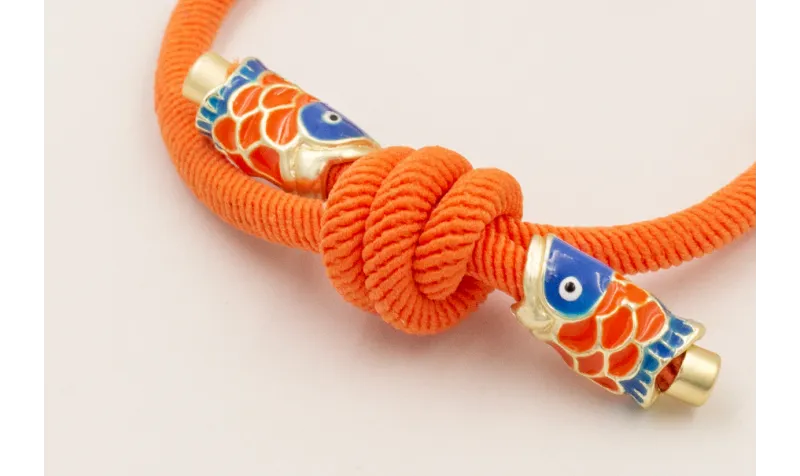 Pulsera cordón elastico naranja con nudo corredizo